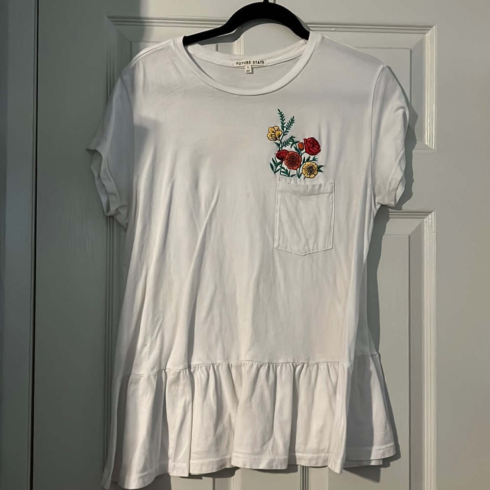 Peplum embroidered floral top.